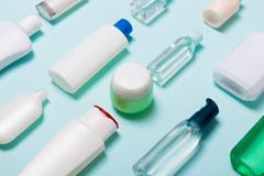 Close-up Set Of Diffrent Sized Bottles And Jars For Cosmetic Products On Blue Backgound. Face And Body Care Concept With Copy Royalty Free Stock Photography Close-up Set Of Diffrent Sized Bottles And Jars For Cosmetic Products On Blue Backgound. Face And Body Care Concept With Copy Royalty Free Stock Photography
