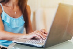 Close-up shot of female hands typing on laptop keyboard royalty free stock photo Close-up shot of female hands typing on laptop keyboard royalty free stock photo
