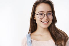 Close-up shot of friendly attractive and cute feminine 20s girl in glasses with brown hair smiling joyfully with hopeful royalty free stock photo Close-up shot of friendly attractive and cute feminine 20s girl in glasses with brown hair smiling joyfully with hopeful royalty free stock photo