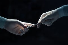 Close-up of surgeons hands hold equipment stock photography Close-up of surgeons hands hold equipment stock photography