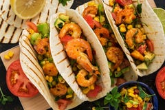 Close up tacos with shrimp. Mexican traditional snack. View from above. stock image Close up tacos with shrimp. Mexican traditional snack. View from above. stock image