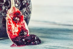 Close up of thick sweet strawberry jam with old spoon. stock photo Close up of thick sweet strawberry jam with old spoon. stock photo