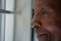 Close up of thoughtful senior man looking out through window Royalty Free Stock Image Close up of thoughtful senior man looking out through window Royalty Free Stock Image