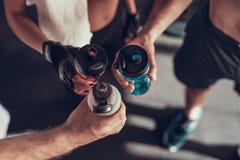 Close Up. Three Hands With Bottles In The Gym stock images Close Up. Three Hands With Bottles In The Gym stock images