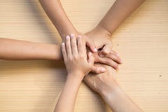Close up top view of young people putting their hands together. royalty free stock photography Close up top view of young people putting their hands together. royalty free stock photography