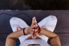 Close Up View Of Unrecognizable Young Asian Woman Doing Yoga In A Park. Sitting On The Bridge With Praying Hands Position And Royalty Free Stock Photos Close Up View Of Unrecognizable Young Asian Woman Doing Yoga In A Park. Sitting On The Bridge With Praying Hands Position And Royalty Free Stock Photos
