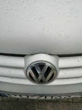 Close up of a Volkswagen Golf car with logo in Poznan, Poland.