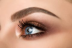 Close-up of woman eye with beautiful brown smokey eyes makeup Royalty Free Stock Photos Close-up of woman eye with beautiful brown smokey eyes makeup Royalty Free Stock Photos