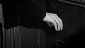 Close-up of woman trying to open locked door
