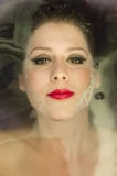 Close up of young woman lying in the water. Relax, makeup. stock images Close up of young woman lying in the water. Relax, makeup. stock images