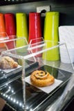 Closed up Cinnamon roll with raisin on black tray and covered wi stock photos Closed up Cinnamon roll with raisin on black tray and covered wi stock photos