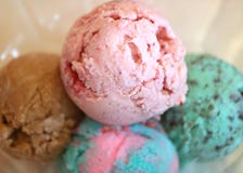 Closed up four scoops of ice cream in a glass bowl, with selective focus royalty free stock photos Closed up four scoops of ice cream in a glass bowl, with selective focus royalty free stock photos