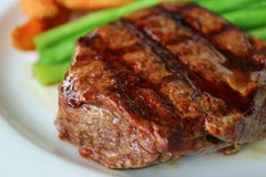 Closed Up Grilled Tenderloin Steak with Blurred Vegetable in Background stock image Closed Up Grilled Tenderloin Steak with Blurred Vegetable in Background stock image