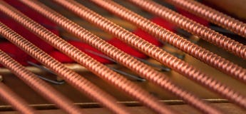 A closeup of the bass strings in a grand piano. royalty free stock photo A closeup of the bass strings in a grand piano. royalty free stock photo