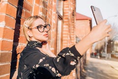 Beautiful cute blonde model in dress posing in the city royalty free stock photos Beautiful cute blonde model in dress posing in the city royalty free stock photos