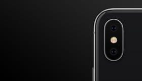 Closeup black similar to iPhone X smartphone dual camera module on black background banner with copyspace royalty free stock photography Closeup black similar to iPhone X smartphone dual camera module on black background banner with copyspace royalty free stock photography