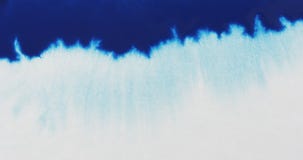 Closeup blue ink border spreading on wet paper top view Stock Photography Closeup blue ink border spreading on wet paper top view Stock Photography