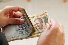 Closeup of businesswoman counting Indian currency notes royalty free stock photography Closeup of businesswoman counting Indian currency notes royalty free stock photography