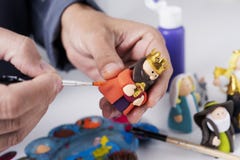 Man painting a maggi of a nativity scene royalty free stock photography Man painting a maggi of a nativity scene royalty free stock photography