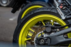 Closeup detail of motorcycle rear wheels and brake disc - Image royalty free stock photography Closeup detail of motorcycle rear wheels and brake disc - Image royalty free stock photography
