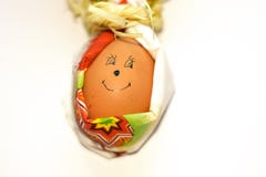 Closeup Easter egg with faced smile in shape of rabbit of paper napkin isolated on white background. Preparation for spring royalty free stock image Closeup Easter egg with faced smile in shape of rabbit of paper napkin isolated on white background. Preparation for spring royalty free stock image