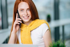 Closeup facial portrait of happy redhead woman on mobile phone call royalty free stock photo Closeup facial portrait of happy redhead woman on mobile phone call royalty free stock photo