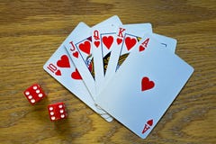 Closeup of Five Playing Cards - a Royal Flush - and two die royalty free stock images Closeup of Five Playing Cards - a Royal Flush - and two die royalty free stock images