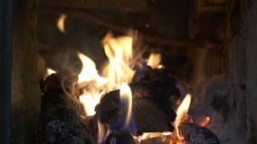 Closeup flame of burning firewood in a brick furnace