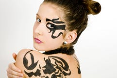 Closeup girl with scorpio painted on back. Closeup of girl with black scorpio sign painted on back and face royalty free stock photography Closeup girl with scorpio painted on back. Closeup of girl with black scorpio sign painted on back and face royalty free stock photography