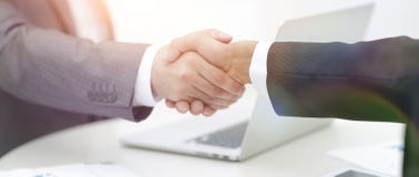 Closeup .handshake Of Business Partners Above The Desk Royalty Free Stock Image