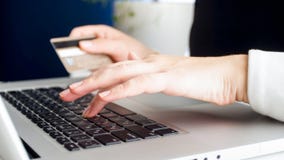 Closeup photo of young woman paying online purchases with credit card royalty free stock image Closeup photo of young woman paying online purchases with credit card royalty free stock image