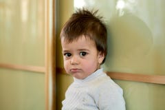 Closeup indoor portrait of a baby boy with naughty hair. The various emotions of a child. stock images Closeup indoor portrait of a baby boy with naughty hair. The various emotions of a child. stock images