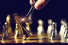 Closeup king chess piece defeated enemy or trade competitor by checkmate at end of chessboard game. Businessman moving chess to