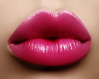 Closeup kiss lip makeup. Beautiful plump full lips on face. Sweet pink lipstick, magenta color. Valentine`s day style stock images Closeup kiss lip makeup. Beautiful plump full lips on face. Sweet pink lipstick, magenta color. Valentine`s day style stock images