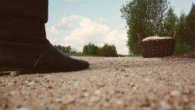 Closeup of male legs in black boots on the field. stock video footage Closeup of male legs in black boots on the field. stock video footage