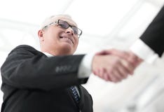 Closeup Of A Business Handshake Partners. The Image Is Blurred. Royalty Free Stock Photography