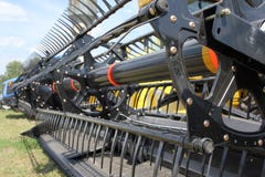 Closeup Of Harvesting Machinery While Working The Royalty Free Stock Images