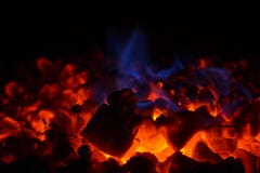 Closeup Of Hot Red Embers And Blue Flame In Fireplace Royalty Free Stock Photography