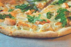 Closeup of pizza with seafood and arugula royalty free stock images Closeup of pizza with seafood and arugula royalty free stock images