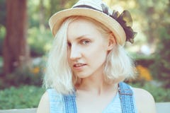 Closeup portrait of beautiful Caucasian teenage young blonde alternative model girl woman in blue tshirt Royalty Free Stock Photography Closeup portrait of beautiful Caucasian teenage young blonde alternative model girl woman in blue tshirt Royalty Free Stock Photography