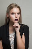 Closeup portrait of luxurious blonde model with purple lips wear royalty free stock photo Closeup portrait of luxurious blonde model with purple lips wear royalty free stock photo