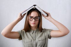 A closeup portrait of pretty young schoolgirl wearing glasses on white background. stock photography A closeup portrait of pretty young schoolgirl wearing glasses on white background. stock photography