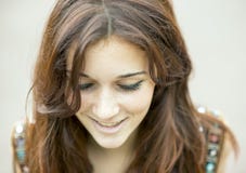 Closeup portrait of smiling beautiful woman looking down. royalty free stock photos Closeup portrait of smiling beautiful woman looking down. royalty free stock photos