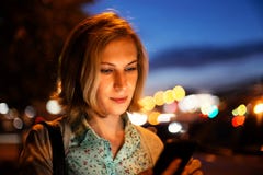 Closeup portrait of a young woman using a smartphone outdoor royalty free stock image Closeup portrait of a young woman using a smartphone outdoor royalty free stock image
