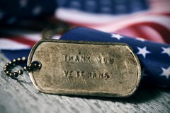 Text thank you veterans in a dog tag