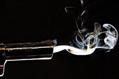 Closeup Shot Of A Smoking Gun With S Black Background Royalty Free Stock Photography
