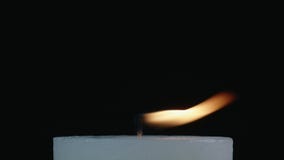 White Candle With Flickering Flame