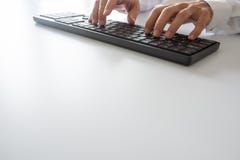 Closeup view of businessman typing on black computer keyboard royalty free stock photos Closeup view of businessman typing on black computer keyboard royalty free stock photos