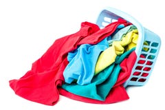 Clothing with a blue container for washing. Stock Photography Clothing with a blue container for washing. Stock Photography