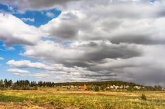 Clouds close the sun, storm clouds over the village stock photos Clouds close the sun, storm clouds over the village stock photos
